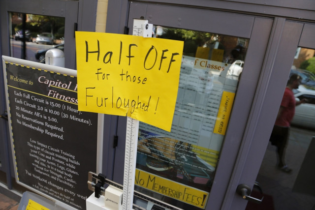 a sign at a fitness studio advertises a deal for furloughed government workers in the capitol hill neighborhood in washington october 5 2013 photo reuters a sign at a fitness studio advertises a deal for furloughed government workers in the capitol hill neighborhood in washington october 5 2013 photo reuters