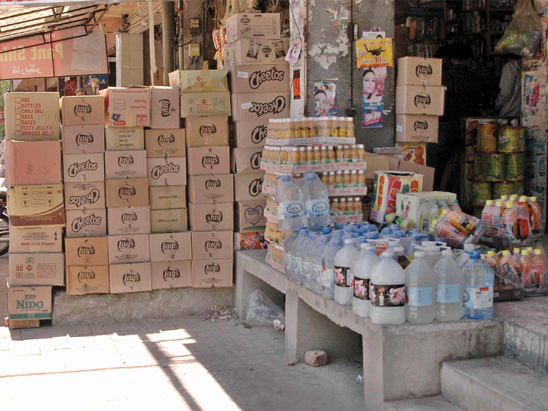 stalls rented out by adjoining shop owners have been set up on the already narrow roads leaving zero space for commuters photo muhammad javaid express