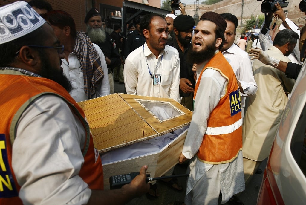 relatives and rescue workers carry the coffin of a man who was killed in the blast photo reuters