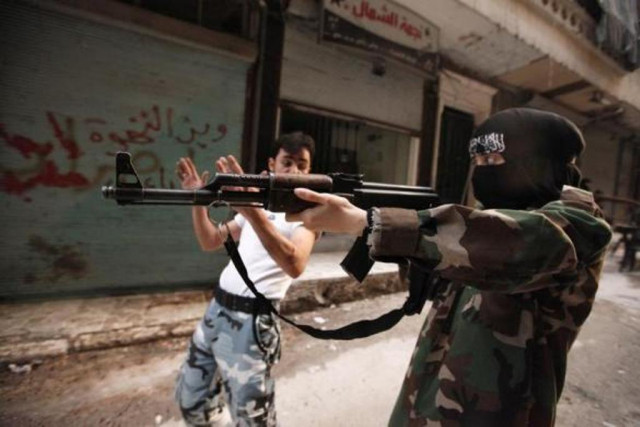 a female member of the quot mother aisha quot battalion receives instruction as she holds a rifle during military training in aleppo 039 s salaheddine district september 19 2013 photo reuters a female member of the quot mother aisha quot battalion receives instruction as she holds a rifle during military training in aleppo 039 s salaheddine district september 19 2013 photo reuters