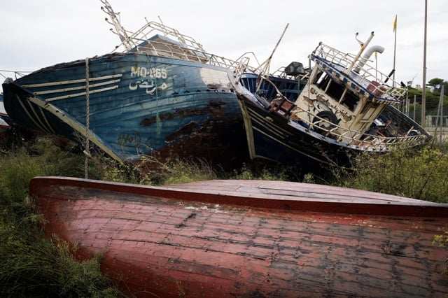 wrecked boats used by immigrants to sail to lampedusa are seen at a boat junk yard near the port of the italian island on october 8 2013 photo afp