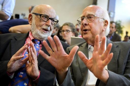 british physicist peter higgs r with belgium physicist francois englert before a scientific seminar to deliver the latest update in the search for the higgs boson at cern in meyrin near geneva on july 4 2012 photo afp