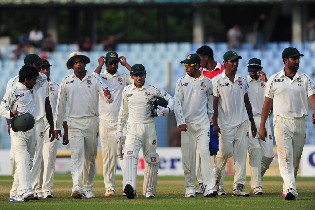 bangladeshi cricketers leave the field after the first day of the first cricket test match between bangladesh and new zealand at the zahur ahmed chowdhury stadium in chittagong on october 9 2013 photo afp