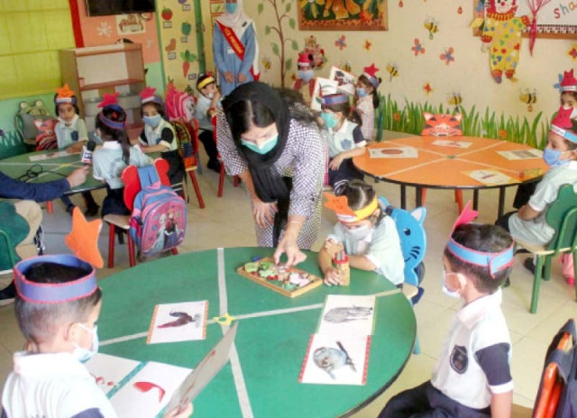 kindergarten children wear facemasks as they play within their designated zones in a classroom after pre primary and primary schools reopened on wednesday photo online kindergarten children wear facemasks as they play within their designated zones in a classroom after pre primary and primary schools reopened on wednesday photo online