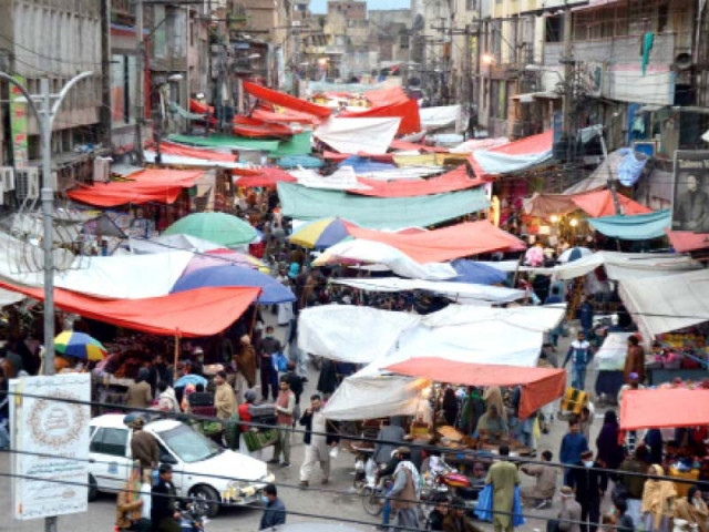 stalls covered with tarps have blocked an entire lane in bara market causing traffic congestion photo inp stalls covered with tarps have blocked an entire lane in bara market causing traffic congestion photo inp