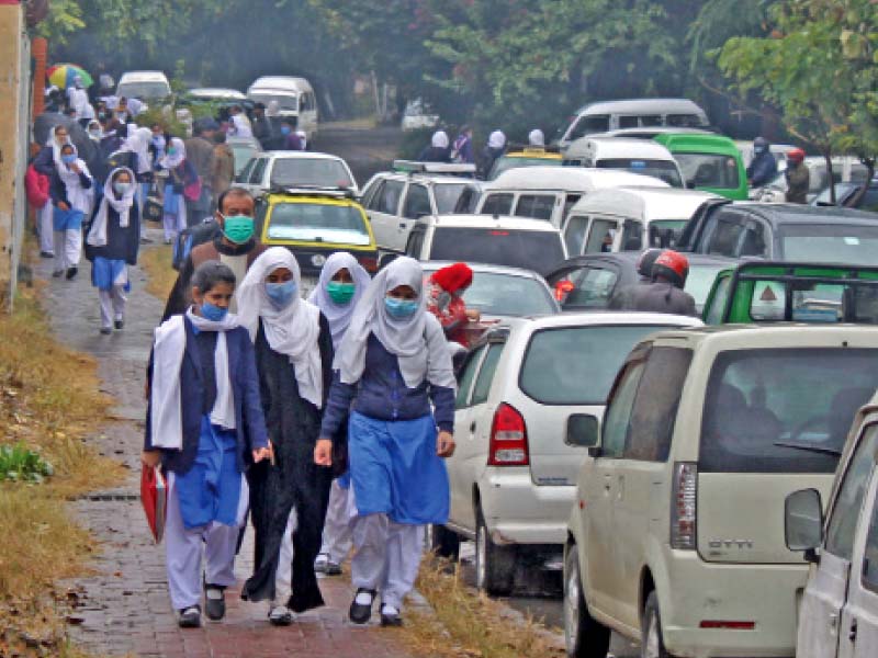 students walk home after the last day of school ahead of the extended winter break announced by the government to prevent the spread of covid 19 photo online