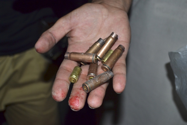 two top officials of their respective police stations in the district west of karachi were killed in a drive by shooting by armed men photo reuters file