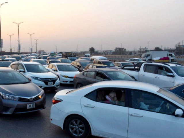cars stand idle on srinagar highway during a protest staged by friends and family of osama satti who was slain by police in islamabad photo inp cars stand idle on srinagar highway during a protest staged by friends and family of osama satti who was slain by police in islamabad photo inp