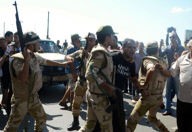 egyptian security forces arrest a protestor during a demonstartion in support of ousted president muhammad mursi photo afp