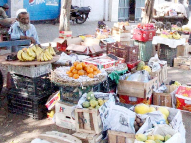 a fruit vendor awaits customers at a roadside in karachi as flies hover over his goods the prices of fruits often skyrocket in ramazan photo nni a fruit vendor awaits customers at a roadside in karachi as flies hover over his goods the prices of fruits often skyrocket in ramazan photo nni