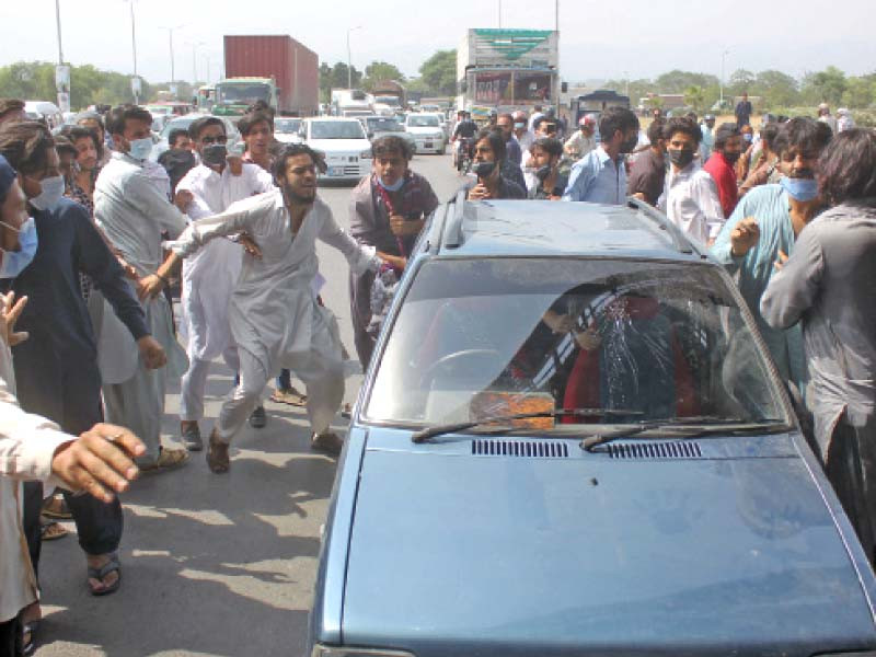 protesting students thrashed citizens and damaged their cars on the islamabad expressway before police arrived at the scene and baton charged the demonstrators to disperse them photo online