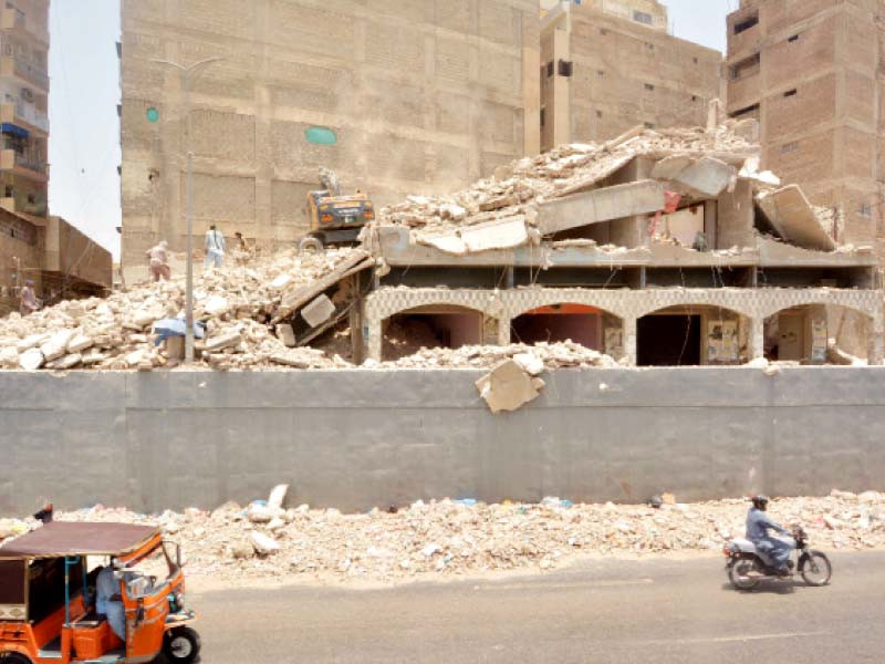 a residential building is being torn down in the khayaban e jami area of the city photo jalal qureshi express