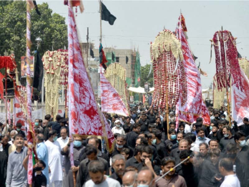 thousands of mourners march through the streets of karachi on muharram 8 paying tribute to the martyrs of karbala photo afp