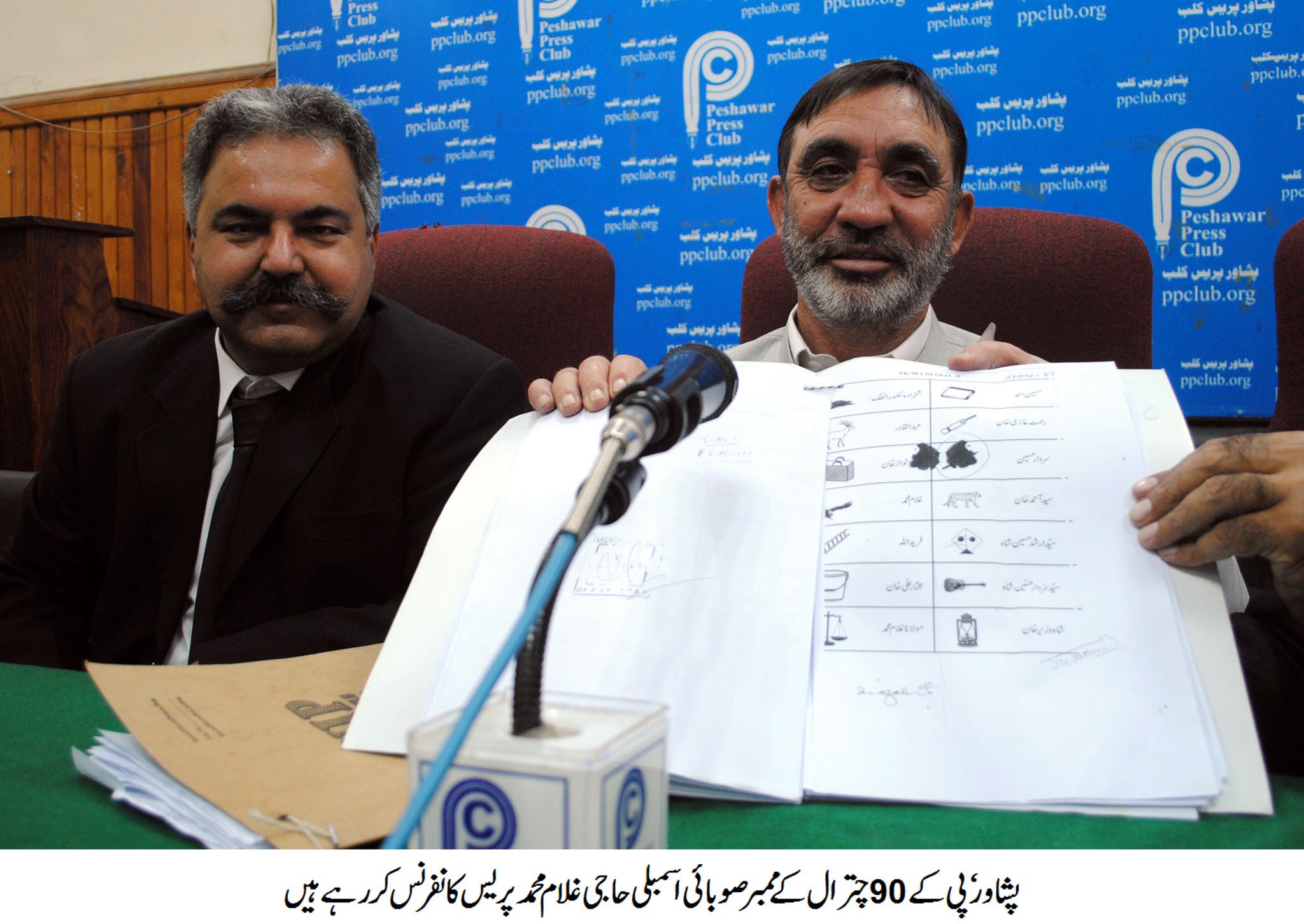 pk 90 chitral candidate haji ghulam muhammad shows off ballot papers during a press conference in peshawar on thursday photo abdul ghaffar baig express