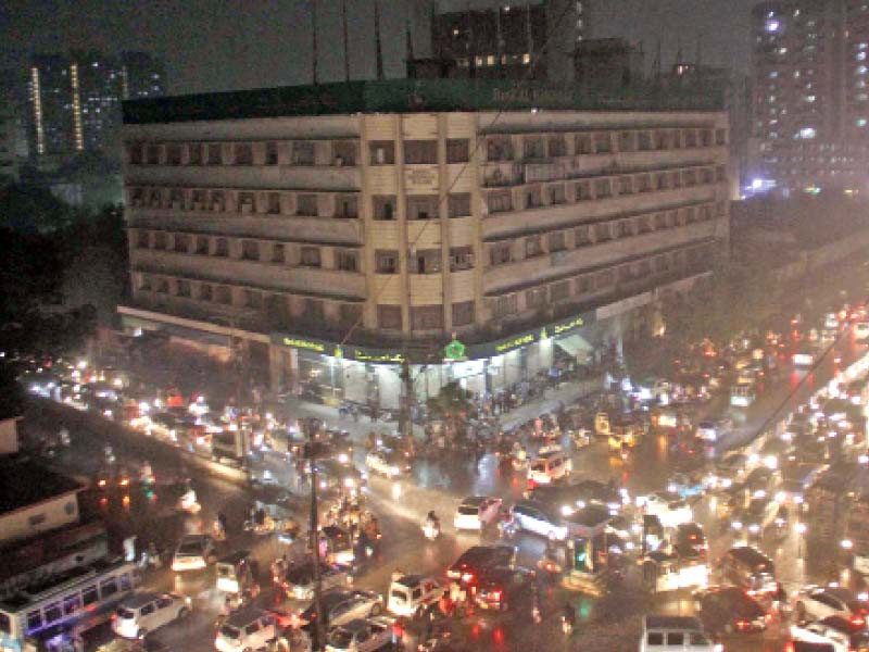 commuters stranded on various thoroughfares of the city as light to heavy showers lash the metropolis on friday power out ages reported across the city further dismayed karachittes photo online