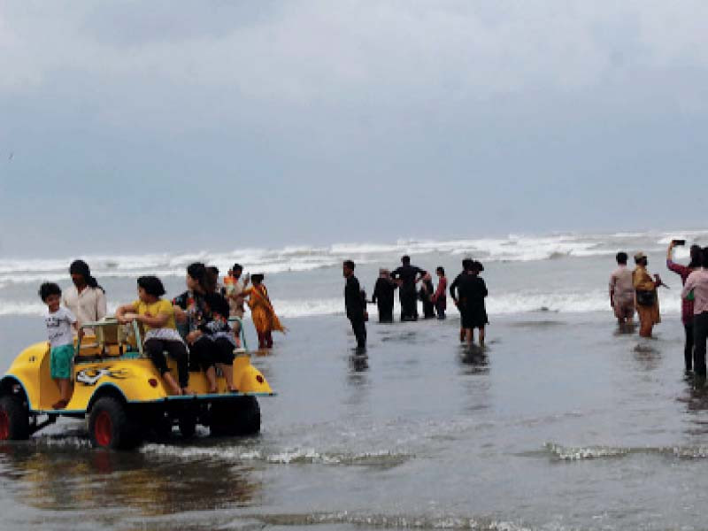 people of the city make merry and take advantage of the cooling weather as cyclone shaheen changes course and heads towards balochistan and onto oman photo nni