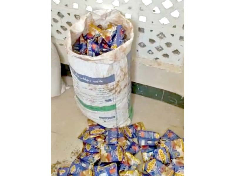 police display gutka seized during a raid on a home in the lyari area of karachi on friday photo express