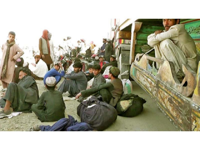 truck drivers rest near the pak afghan border as they wait to cross over photo express truck drivers rest near the pak afghan border as they wait to cross over photo express