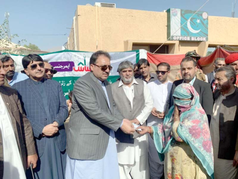 balochistan governor syed zahoor agha distributes ehsaas cash cheques to harnai quake survivors photo express