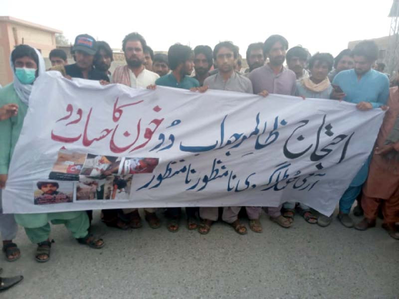 residents of chaghi chant slogans and display banners during a demo protest photo express