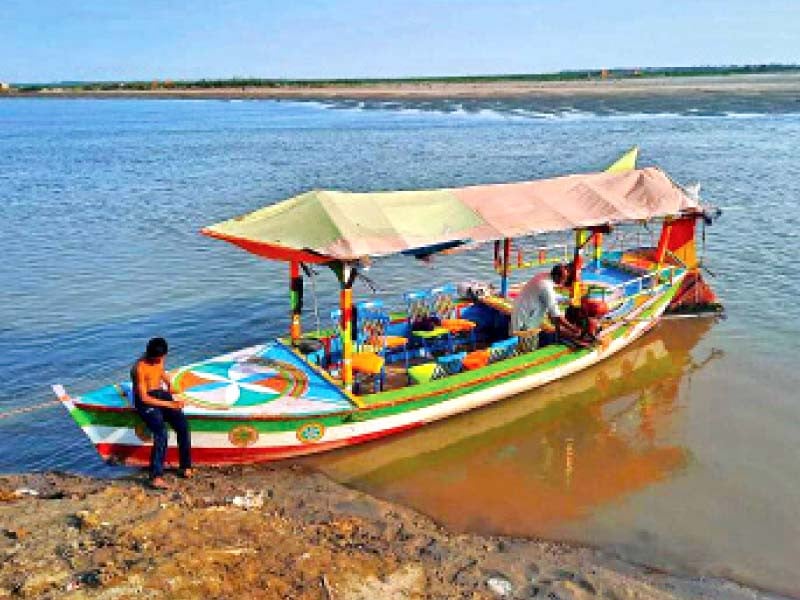 an anchored boat waits for tourists photo file