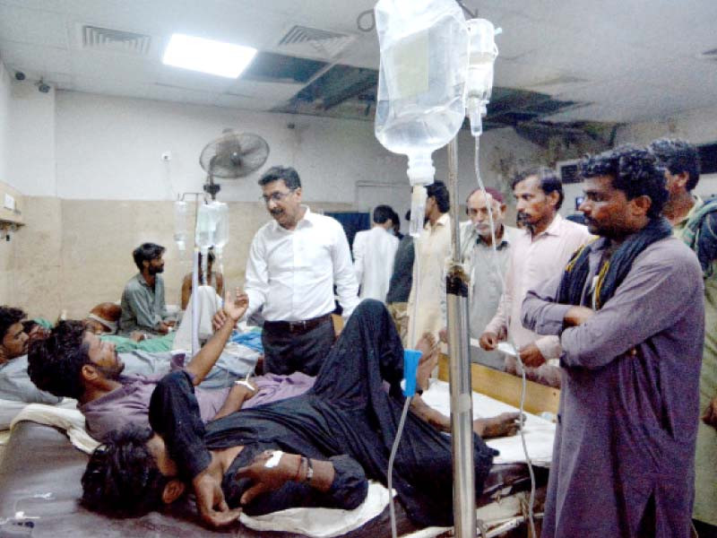 doctors attend to labourers who had fallen ill after consuming a drugged milk soda drink photo express