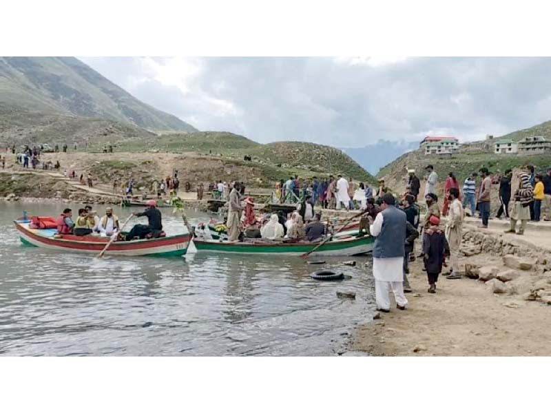 tourists enjoy the scenic view at lake saiful malook photo express