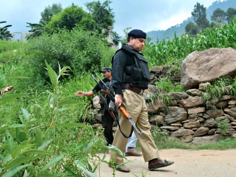 policemen carry out a search and strike operation in the hills of buner photo express