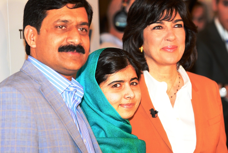 malala yousafzai poses for photographers with her father ziauddin and journalist christiane amanpour prior to taking part in a panel discussion in new york october 10 2013 photo afp