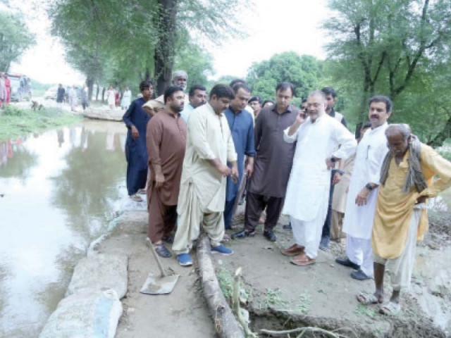 sindh information minister sharjeel memon checks flow of water in the drain along the autobahn road hyderabad photo express sindh information minister sharjeel memon checks flow of water in the drain along the autobahn road hyderabad photo express