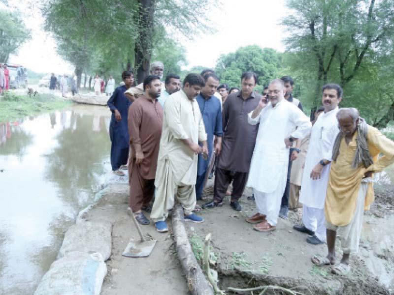 sindh information minister sharjeel memon checks flow of water in the drain along the autobahn road hyderabad photo express