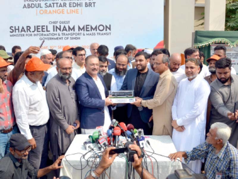 sharjeel memon faisal edhi saeed ghani and other officials at the opening of brt abdul sattar edhi orange line bus service photo express