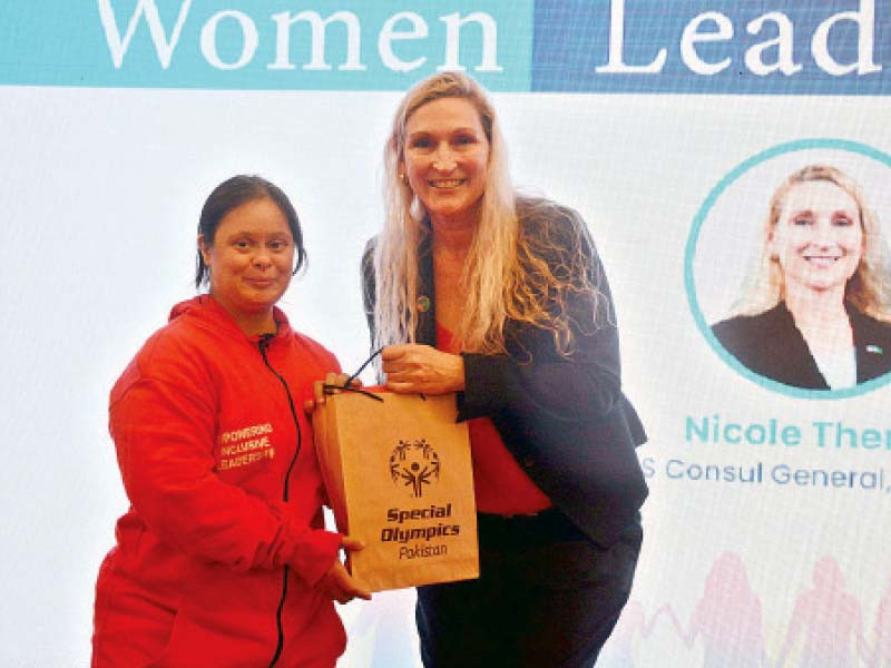 a special child presents a gift to us consul general nicole theriot at the 11th international women leaders summit photo app