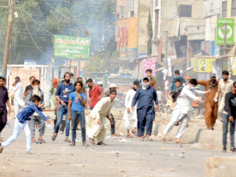 men throw stones at police and kda officials during an anti encroachment operation in gulistan e jauhar area of karachi on tuesday photo jalal qureshi express