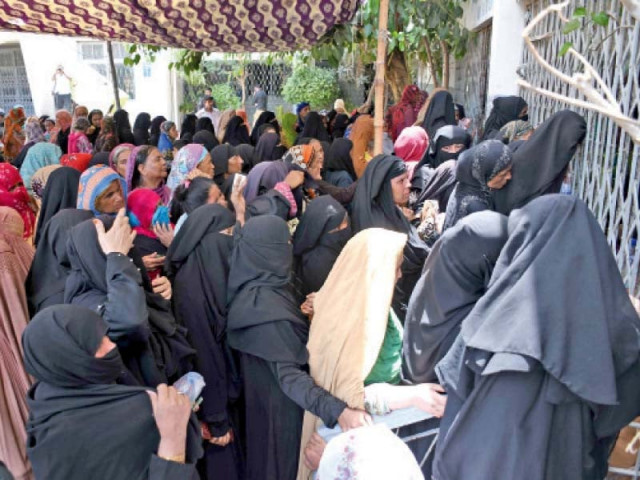 women wait outside the kpt govt secondary school to receive stipend under the benazir income support programme on monday a stampede occurred later at the site when the women rushed in on the opening of the gate photo online women wait outside the kpt govt secondary school to receive stipend under the benazir income support programme on monday a stampede occurred later at the site when the women rushed in on the opening of the gate photo online