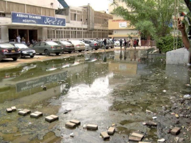 overflowing gutter in front of abbasi shaheed hospital is spreading infectious diseases photo express overflowing gutter in front of abbasi shaheed hospital is spreading infectious diseases photo express
