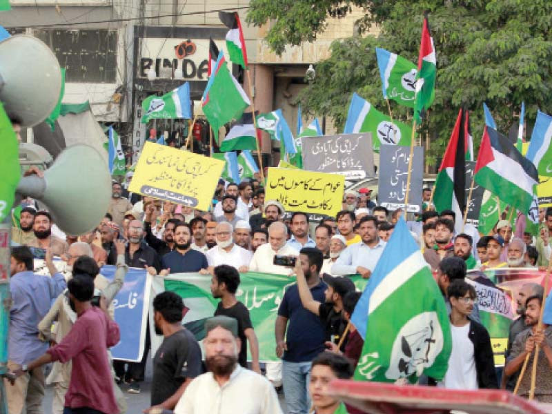 supporters of jamaat e islami march towards the governor house to stage a protest sit in against food and fuel inflation on sunday photo ppi