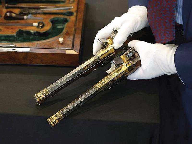 selling above the estimated price the richly decorated guns inlaid with gold and silver feature the engraved image of napoleon in full imperial pomp photo file