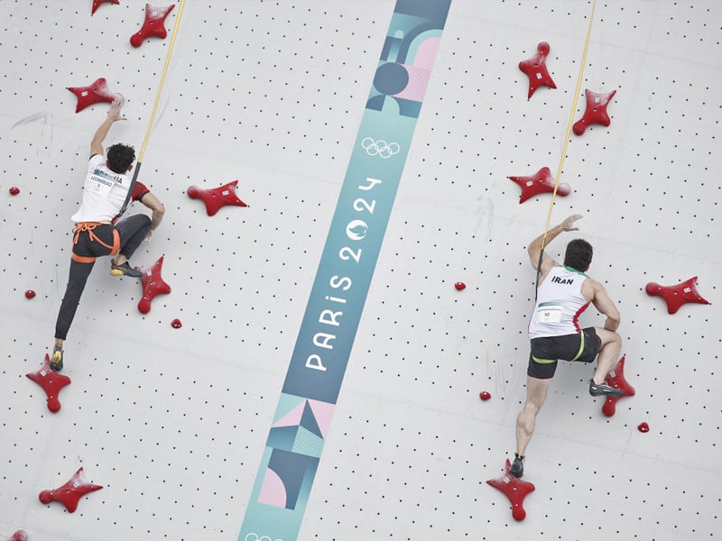 veddriq leonardo of indonesia l and reza alipour shenazandifard of iran in action at the speed climbing event on thursday photo reuters