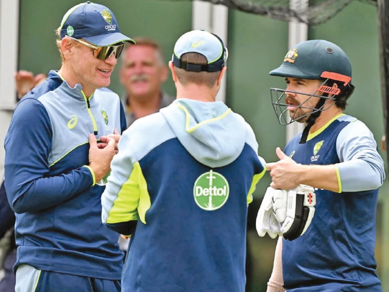 travis head right speaks with coach andrew mcdonald left and physio nick jones centre about his quad issue photo cricket australia