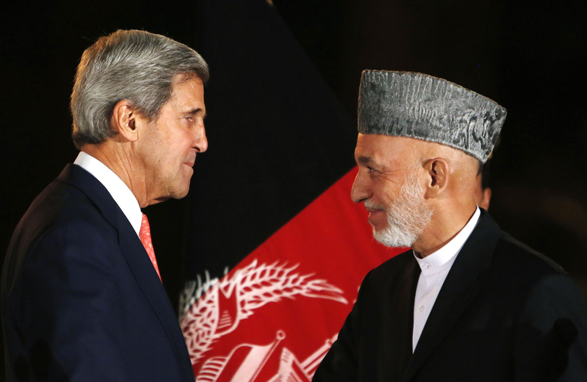 afghanistan 039 s president hamid karzai r talks with us secretary of state john kerry l after a news conference in kabul october 12 2013 photo reuters