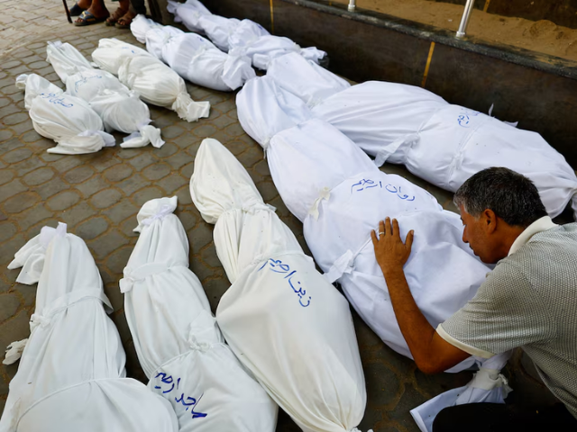 A mourner reacts during the funeral of Palestinians from Irheem family, who were killed in an overnight Israeli strike, according to medics, in Gaza City August 11, 2025. REUTERS