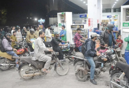as the city runs on fumes motorcyclists line up at a petrol pump in karachi waiting their turn amid surge in fuel prices photo jalal qureshi express