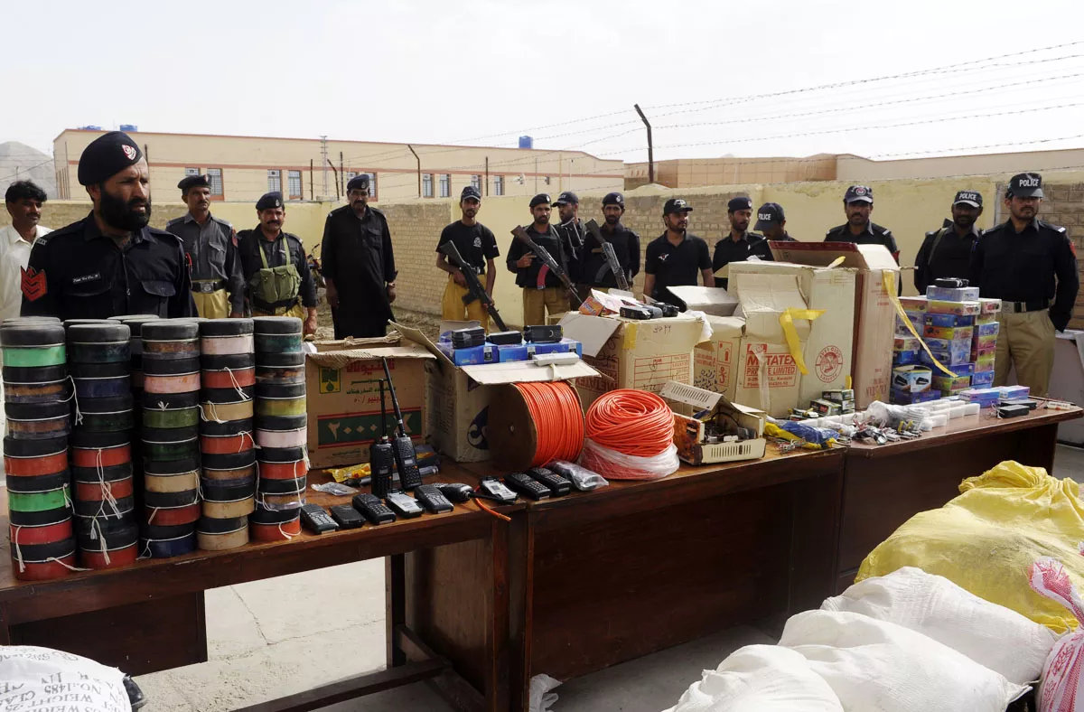 pakistani police officials stand beside seized explosive material on display in quetta photo afp file pakistani police officials stand beside seized explosive material on display in quetta photo afp file
