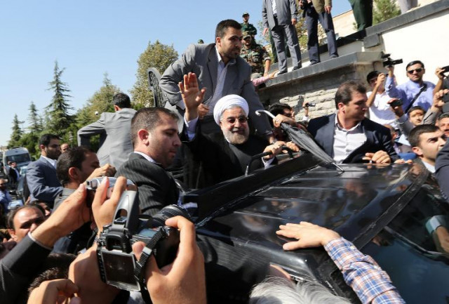 iranian president hassan rouhani waves at his supporters as his motorcade leaves tehran photo afp iranian president hassan rouhani waves at his supporters as his motorcade leaves tehran photo afp