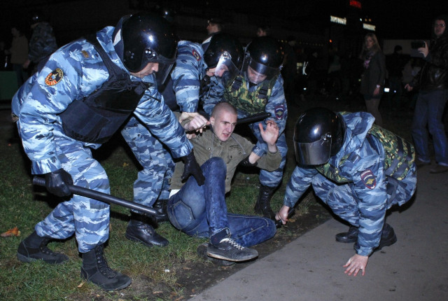 russian police detain a man after a protest in the biryulyovo district of moscow october 13 2013 photo reuters russian police detain a man after a protest in the biryulyovo district of moscow october 13 2013 photo reuters