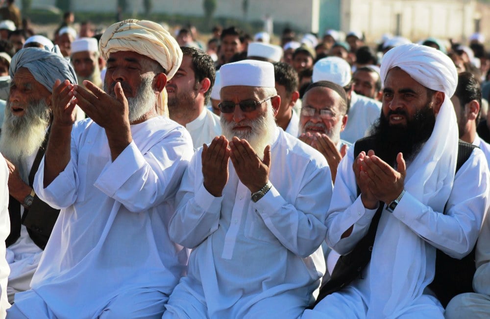 afghan refugees offering eid prayers at the kacha garhi camp peshawar on october 15 2013 photo muhammad iqbal