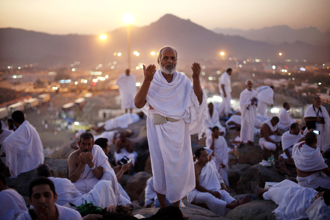 a pilgrim lifts his hands in prayer on the plain of arafat near the city of makkah photo reuters