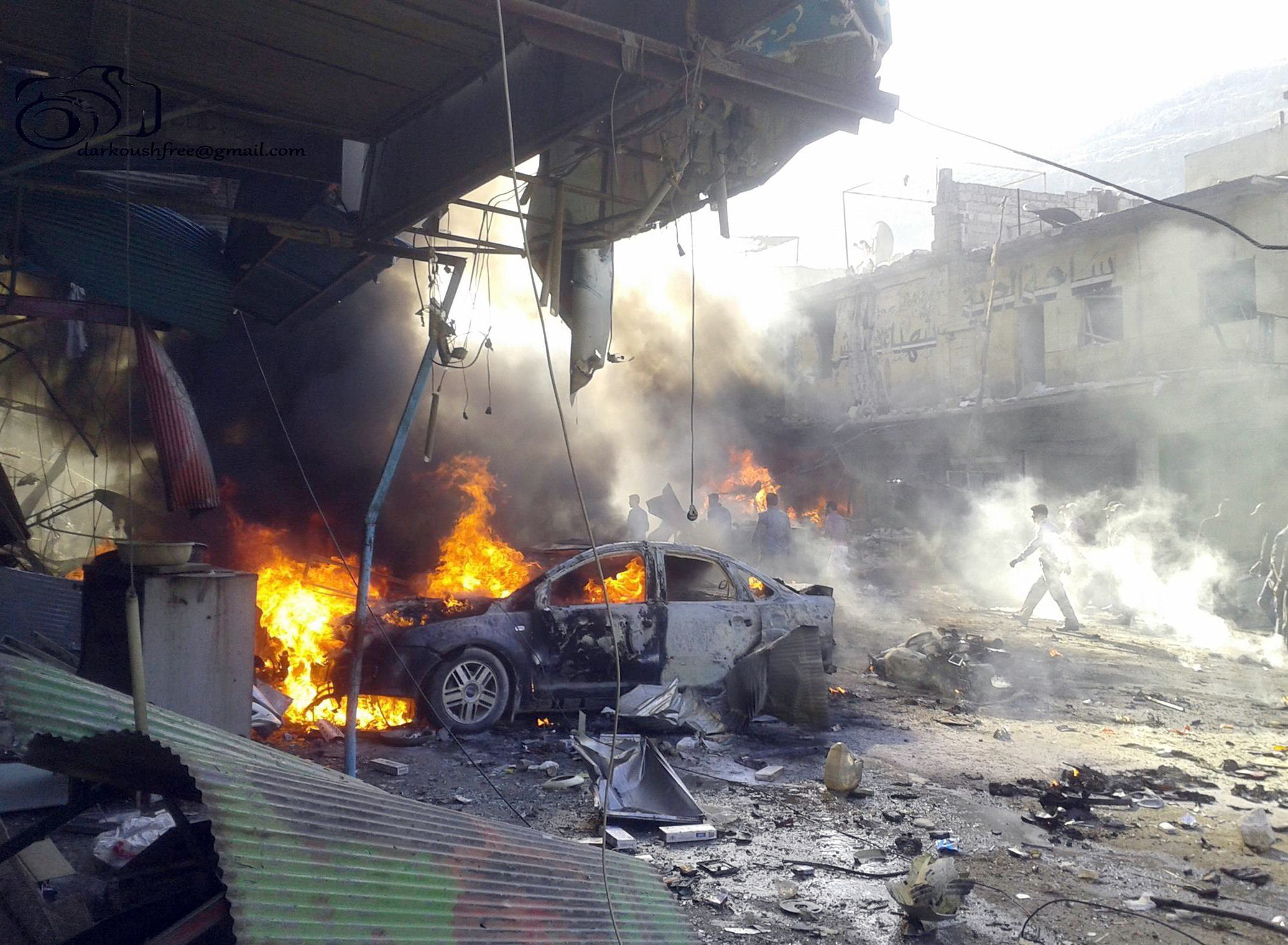 vehicles burning following an explosion in the town of darkush in idlib province photo afp