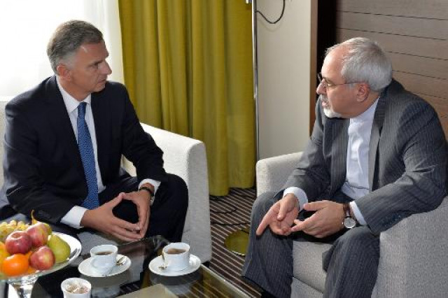 iranian foreign minister mohammad javad zarif r speaks with his swiss counterpart didier burkhalter during a meeting on the sideline of nuclear talks on october 16 2013 in geneva photo afp iranian foreign minister mohammad javad zarif r speaks with his swiss counterpart didier burkhalter during a meeting on the sideline of nuclear talks on october 16 2013 in geneva photo afp